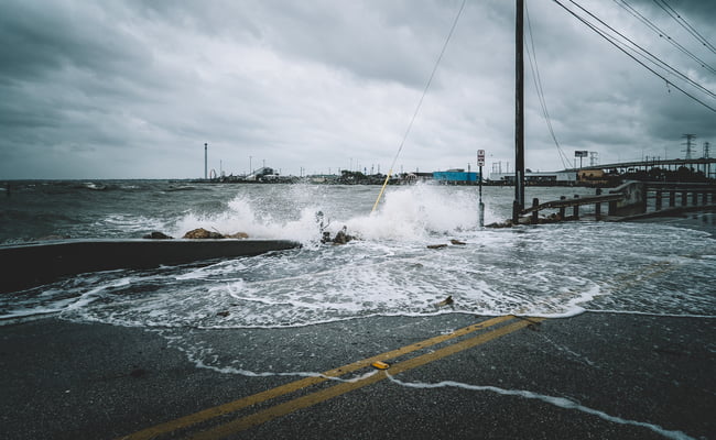 coastal flood damaging homes on coast