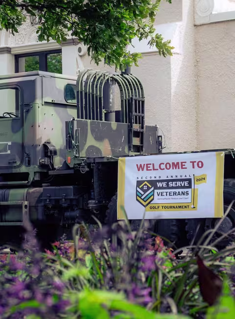 Military vehicle with Hire Heros banner