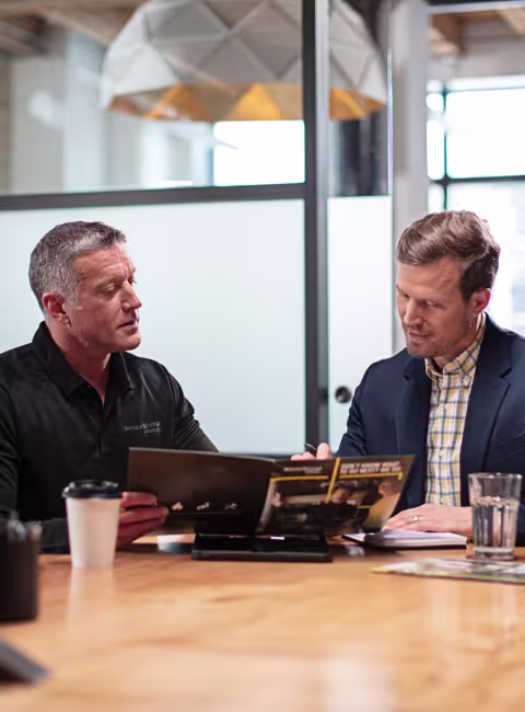 business owner reviewing options with servicemaster rep