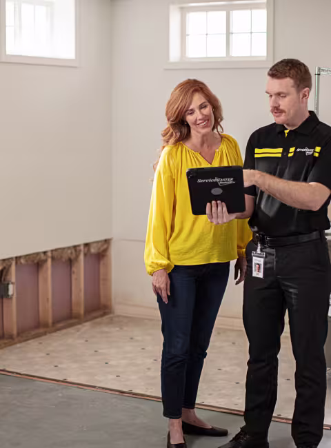servicemaster technician giving options to customer