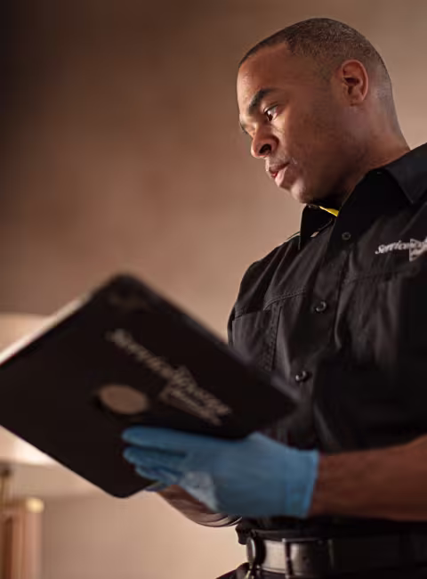 servicemaster technician documenting fire damage