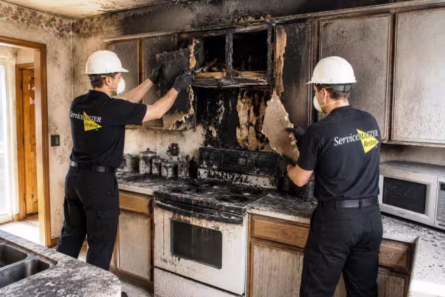ServiceMaster technicians performing controlled demo of fire damaged kitchen in Dawson County, NE
