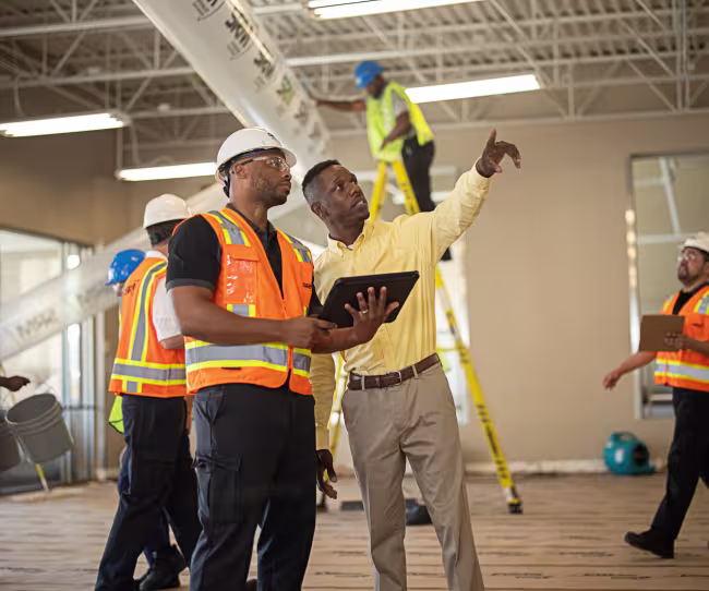 servicemaster restoration technician talking with business owner in their commercial space