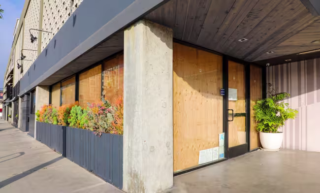 downtown business with windows and doors boarded up