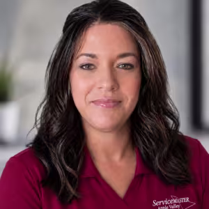 Portrait of a woman wearing a pink ServiceMaster Polo