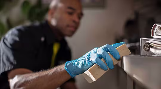 ServiceMaster Restore employee cleaning shelf