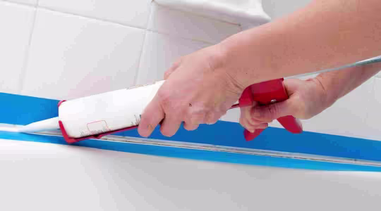 caulking bathroom tile