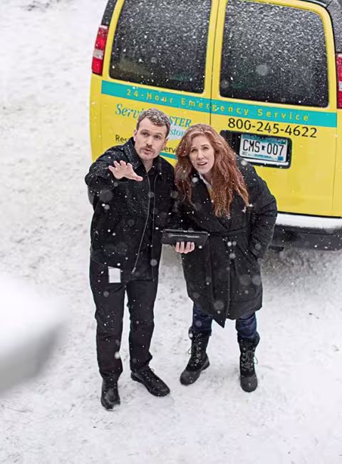 Restore team outside with customer in the snow
