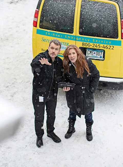 Restore team outside with customer in the snow