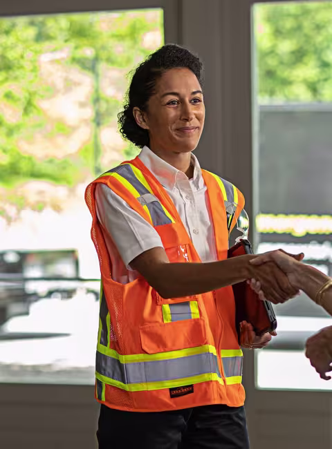 Two woman shaking hands