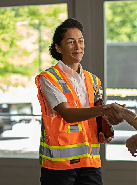 Two woman shaking hands