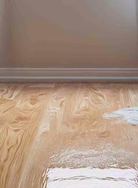 bedroom with water damage on floor
