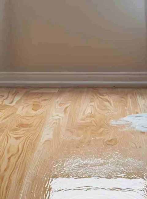 bedroom with water damage on floor