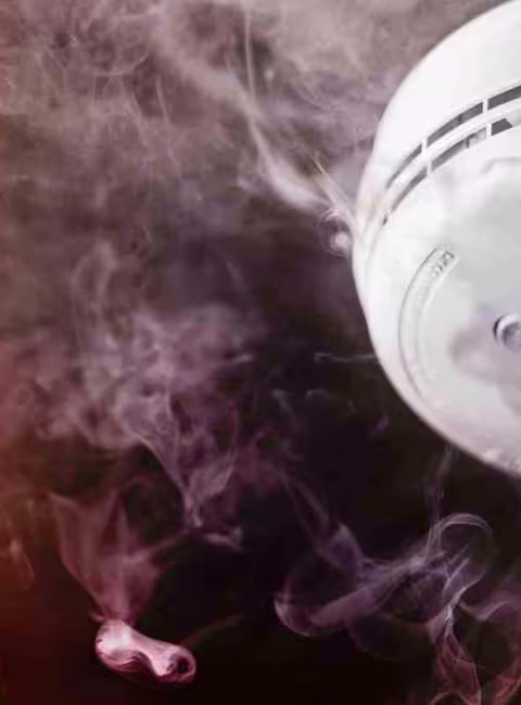 smoke alarm surrounded by smoke