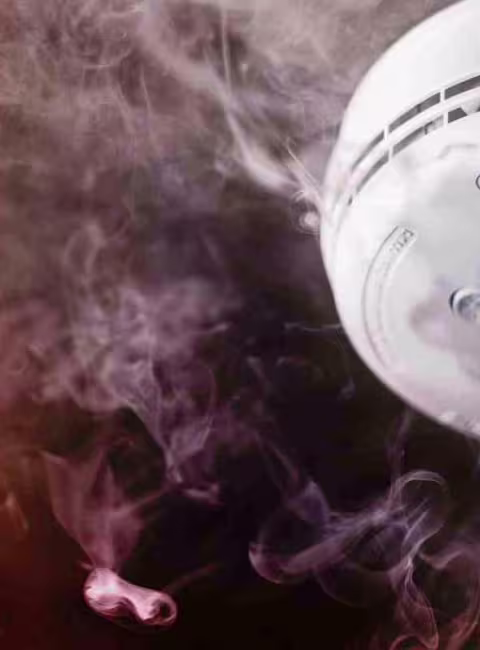 smoke alarm surrounded by smoke