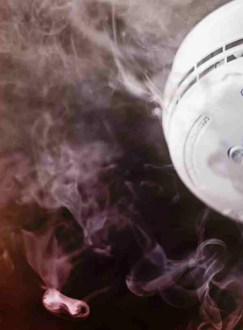 smoke alarm surrounded by smoke