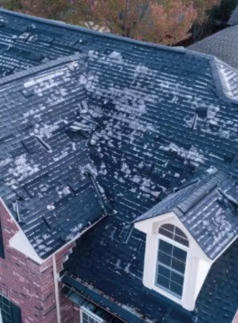 Hail shingle damage in a roof
