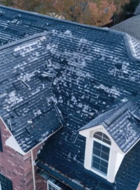 Hail shingle damage in a roof