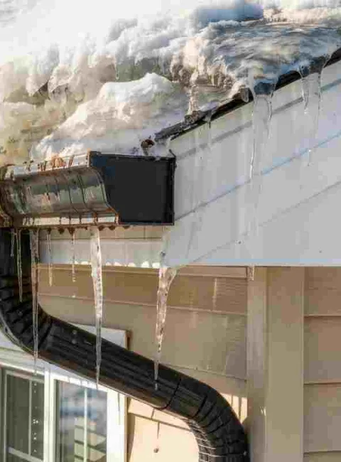 snow melting from a roof in the spring