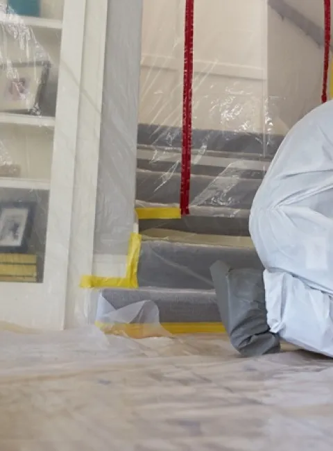 a servicemaster fire & water cleanup technician is providing mold remediation services in a chicagoland home