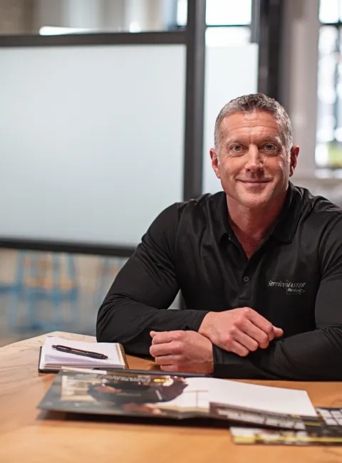 servicemaster commercial service representative at desk