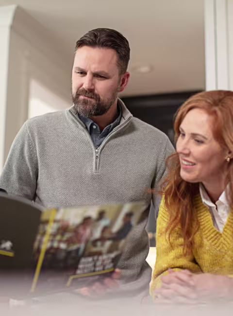 servicemaster restore technician and customers reading mold restoration options