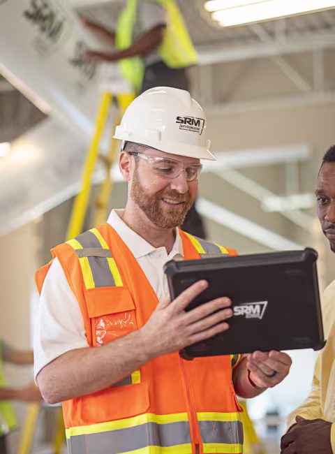 servicemaster restore technician discussing restoration with business owner