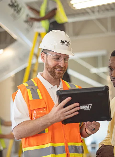 servicemaster restore technician discussing restoration with business owner