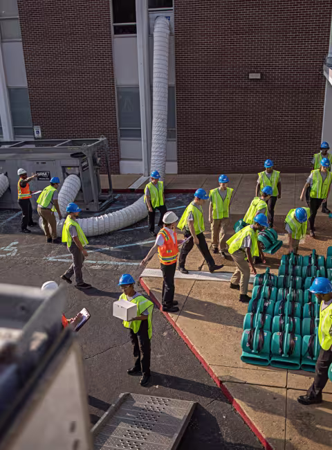 above pov of servicemaster restore technicians setting up drying equipment in a retail space