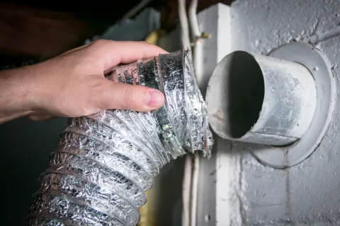 Detaching vent exhaust hose from dryer