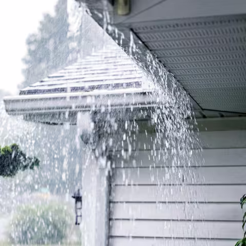 Water overflowing from gutter due to excessive rain