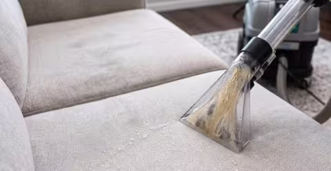 Dirty water shown running through a clear upholster extraction tool