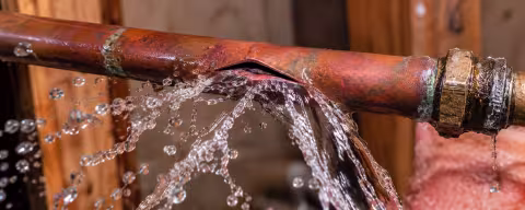 Water spraying from a broken copper supply line