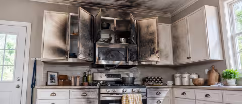Fire damaged kitchen cabinets and appliances