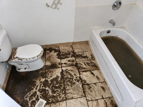 sewage backed up onto bathroom floor and filled up in tub