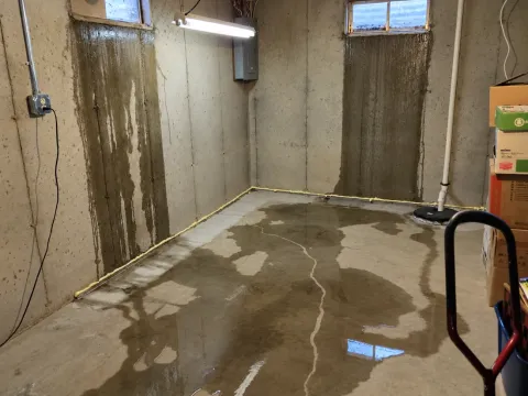 water leaking through basement windows onto concrete floor