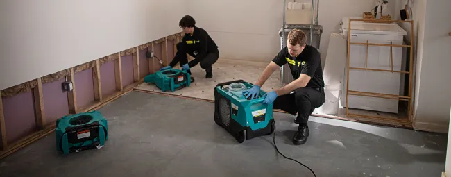 ServiceMaster employees cleaning up water