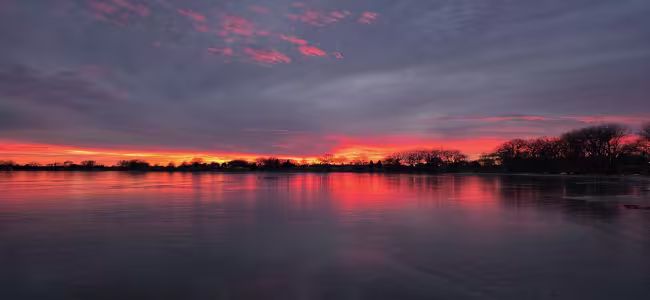 Sunset at Johnson Lake NE near homes served by ServiceMaster of Mid NE