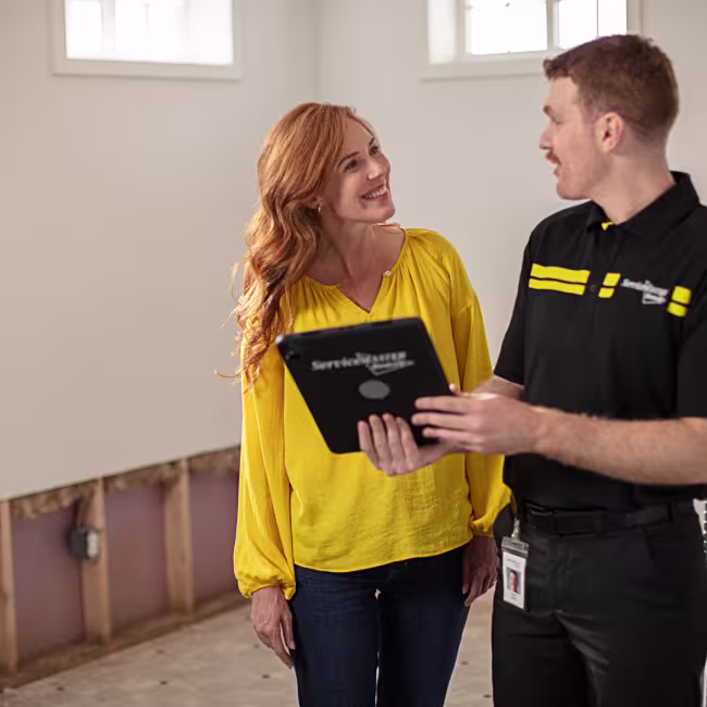 lexington ky servicemaster technician advising customer