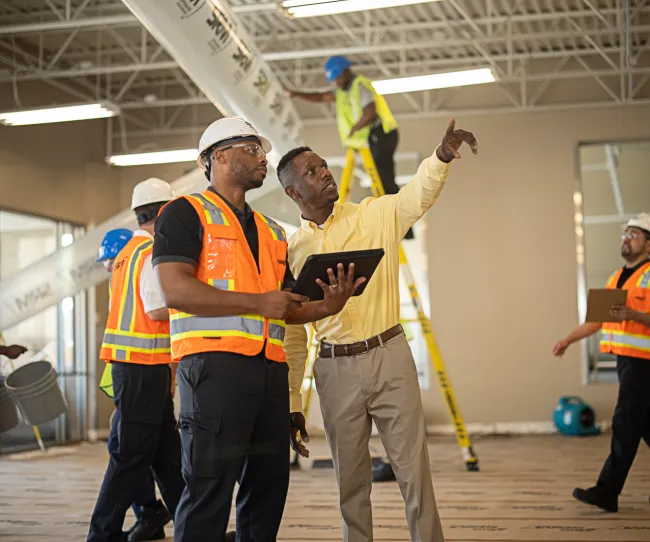 servicemaster restoration technician talking with business owner in their commercial space