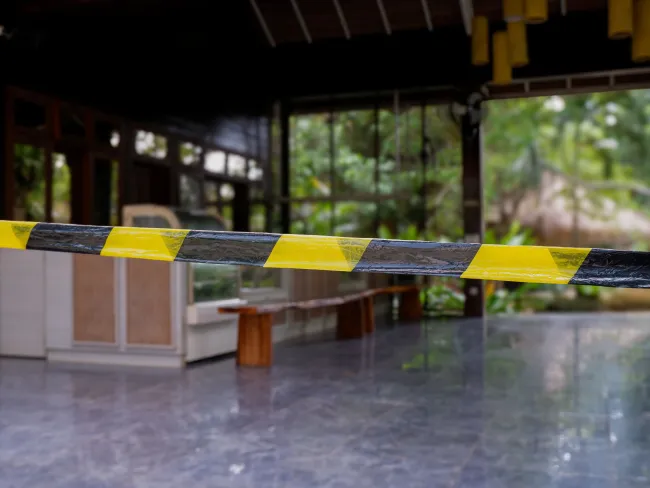 caution tape at business entrance