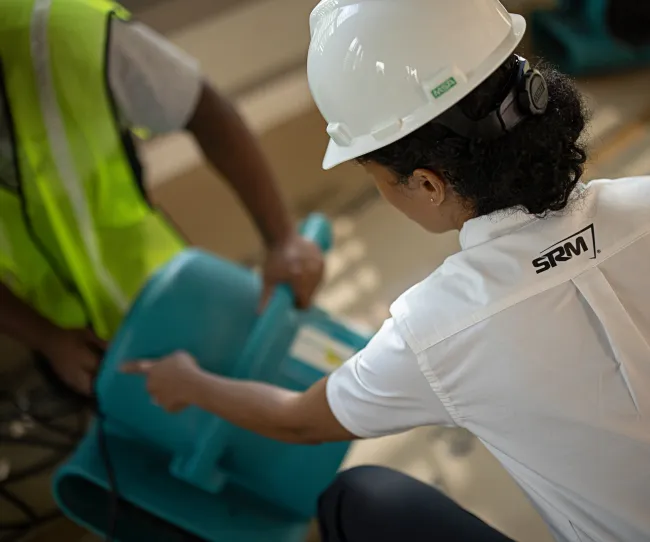 servicemaster restore technicians working with industrial dryer units