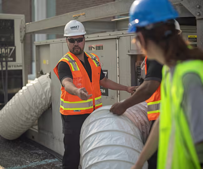servicemater technician setting up large scale water extraction for commercial water damage