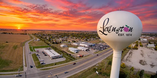 lexington, NE water tower on Plum Creek Parkway at sunset
