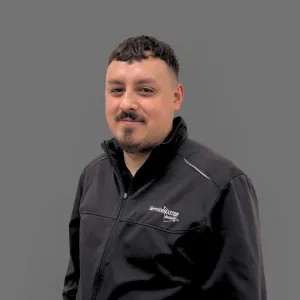 Jose wearing black ServiceMaster uniform. 