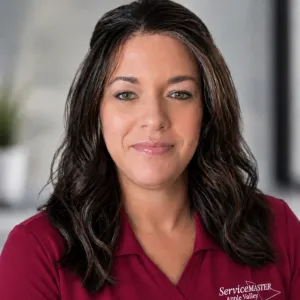 Portrait of a woman wearing a pink ServiceMaster Polo