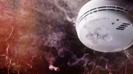 smoke alarm surrounded by smoke
