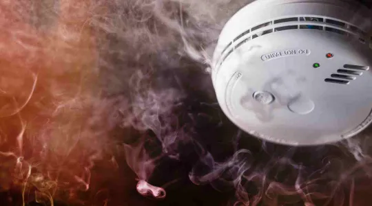 smoke alarm surrounded by smoke