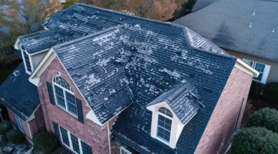Hail shingle damage in a roof