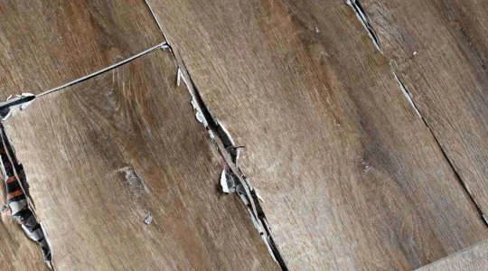 warped floor with water damage